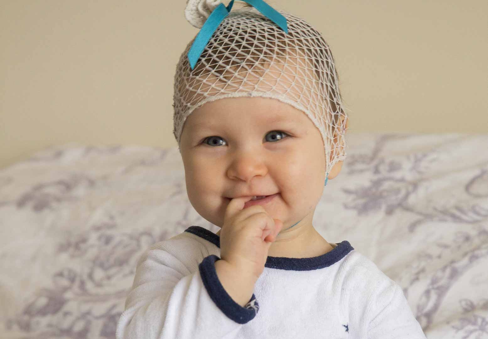 child holding hand during photo shoot